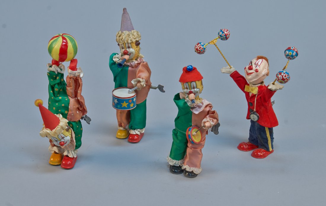 Lot Of 4 - Vintage Misc. Made In Japan Litho. Tin Wind-: Lot Of - 4 Vintage Misc. Made in Japan Litho. Tin Wind-Up Toys, c1950s, Including: 1- clown walking on hands w/ ball - 10-1/2"h, 2- walking clowns playing drum & tooting horn - 11"h. each, & 1- clown 