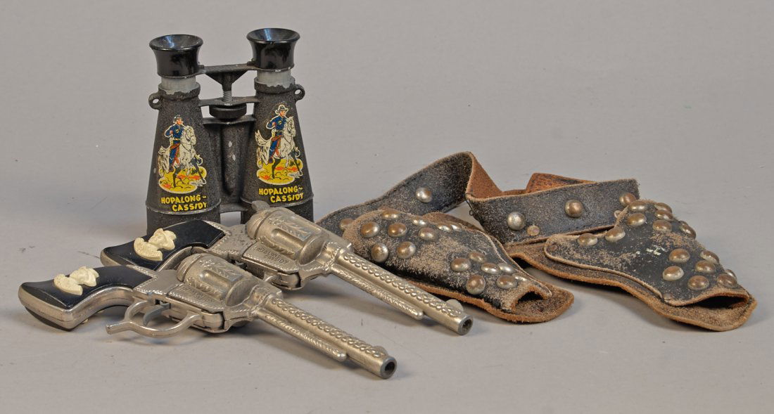 Lot of 2 - "Hop-A-Long Cassidy" Toy Items:: Lot of 2 Hop-A-Long Cassidy Toy Items: 1- Pair of pearl handled pistols w/ leather, studded holster & 1- Black metal binoculars