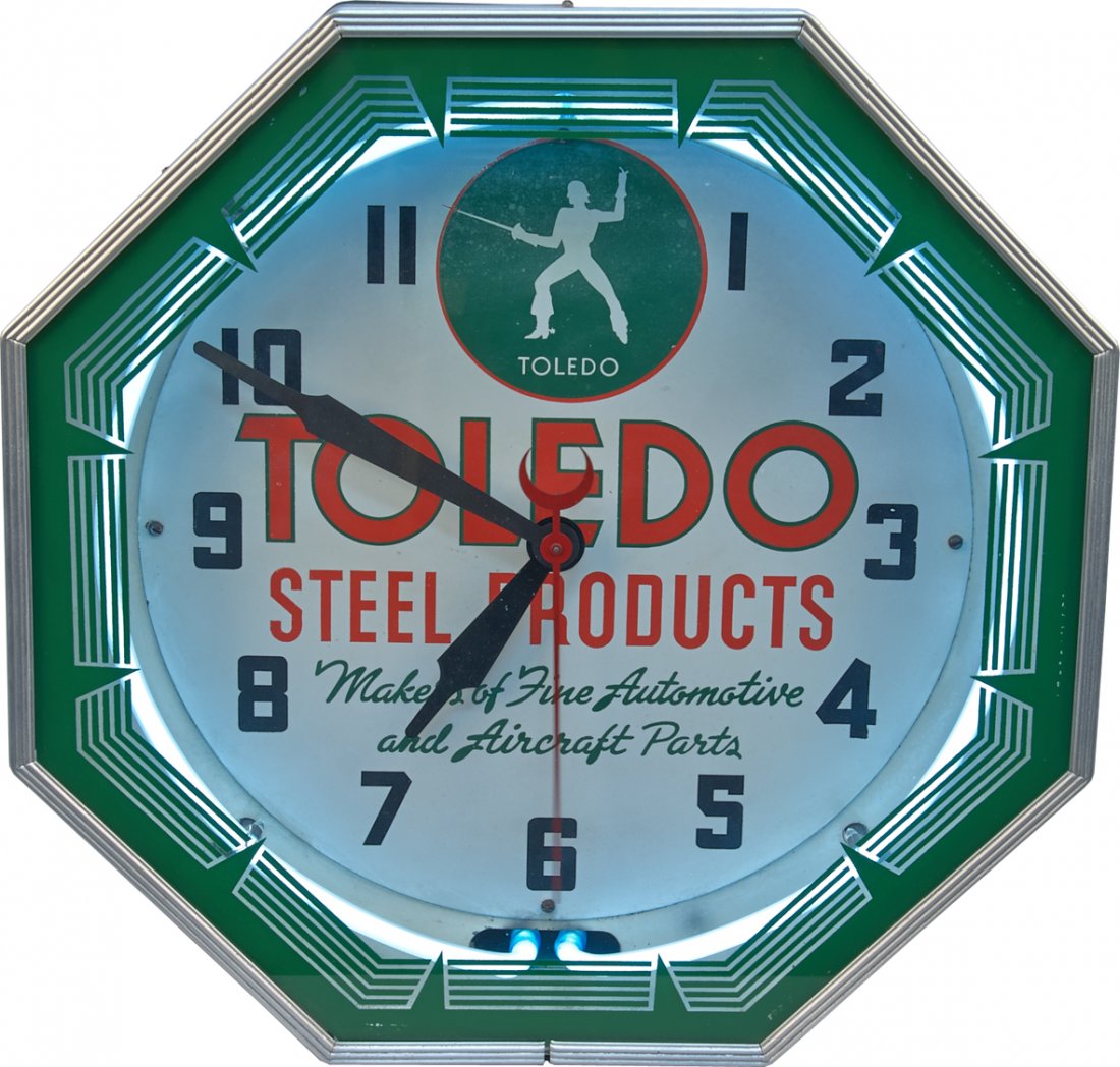 Toledo Steel Products Light-Up Neon Advertisement Wall: Toledo Steel Products Light-Up Neon Advertisement Wall Mount Clock, Glass & metal w/ interior neon border, Octagon-shaped, "Makers of Fine Automotive and Aircraft Parts", Nice condition - 18" x 18"