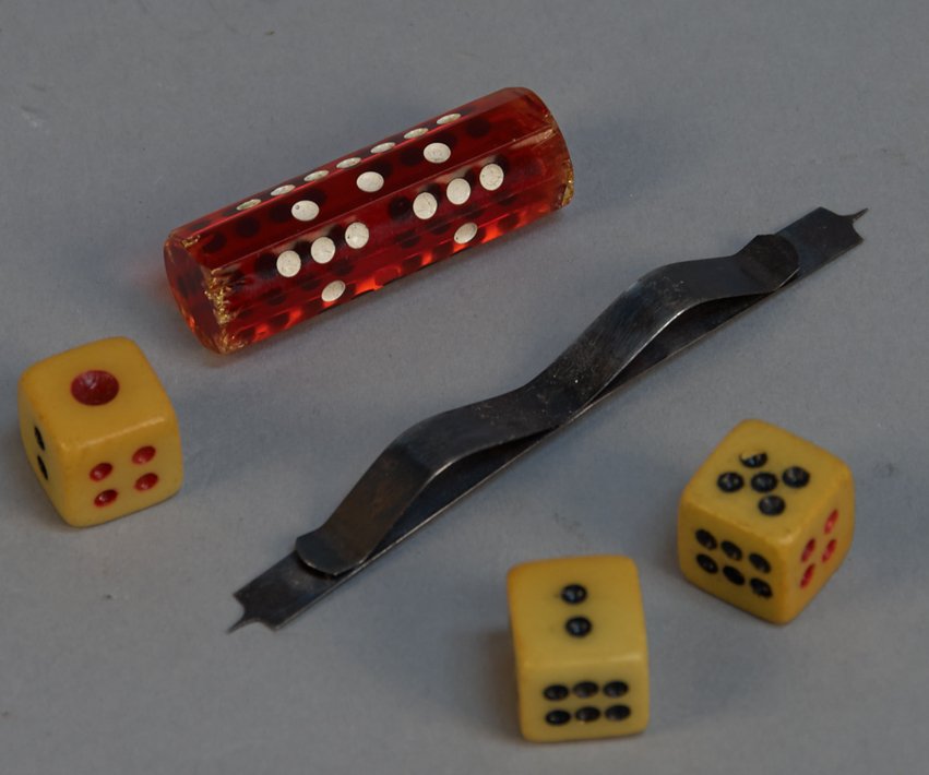 Lot of 3 Early Gambling Items:: Lot of 3 Early Gambling Items: 1 - Set Of 3 Hazard Dice, 1 - Gamblers Red Rolling Log & 1 - Under The Table Metal Hold-Out