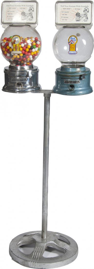2 Ford 1 Cent Gumball Vending Machines On Cast-Iron Sta: 2 Ford 1 Cent Gumball Vending Machines On Cast-Iron Stand w/ Gumballs, Manufactured by Ford Gum & Machine Co. Inc Akron, N.Y., Both w/ fortune teller fold-up hinged top signs "Tell Your Fortune with G