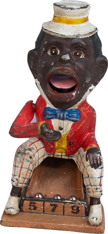 Early J.E. Stevens Countertop Cast-Iron Figural Black A: Early J.E. Stevens Countertop Cast-Iron Figural Black Americana Skill Game w/ 3 metal balls, Place ball in man's hand, press lever, and he deposits ball into his mouth - it comes back out into a tray 