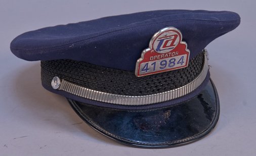 Tanen And Company New York Driver Uniform Hat: Tanen and Company New York Driver Uniform Hat w/ TA Operator Badge No. 41984 on front, Size 7 3/4, Excellent condition