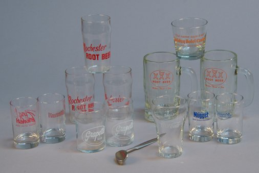 Lot of Misc. Drinking Glasses, etc.:: Lot of Misc. Drinking Glasses, etc.: Including "Drink XXX Root Beer - Makes Thirst A Joy" mugs, Grapette soda, Drink Coca-Cola, Holiday Hotel & Casino, etc. w/ monogrammed Wilson golf club letter open