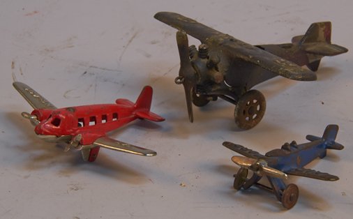 Lot of 3 - Vintage Made In USA. Cast-Iron Airplanes:: Lot of 3 - Vintage Made in USA. Cast-Iron Airplanes: 1 - A.C. Williams "UX-166" Lindy-type plane - 5-3/4" (wing-span), 1 - Hubley "TAT NC431" twin engine No. 389, missing 1 wheel - 5-5/8" (wing-span)