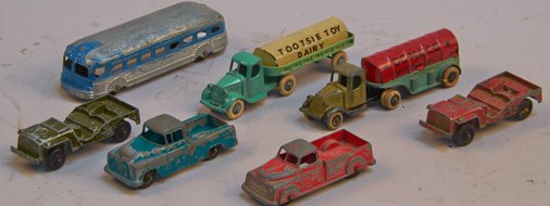 Lot of 6 - Vintage Tootsietoys Die-Cast Vehicles:: Lot of 6 - Vintage Tootsietoys Die-Cast Vehicles: 1 - Pre-war Mack "DOMACO" tank semi-trailer, 1 - Pre-war Mack "TOOTSIE TOY DAIRY" semi-trailer, 1 - Jeep CJ3 Army (green), 1 - Jeep CJ3 civilian (red)