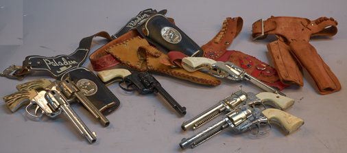 Lot of 6 - Vintage Mattel Die-Cast Fanner-50 Toy Cap Pi: Lot of 6 - Vintage Mattel Die-Cast Fanner-50 Toy Cap Pistols c1957-1965, 5 - in silver finish, white plastic grips, 1 - black finish, white plastic grip - each approx. 11"l. All come in leather holste