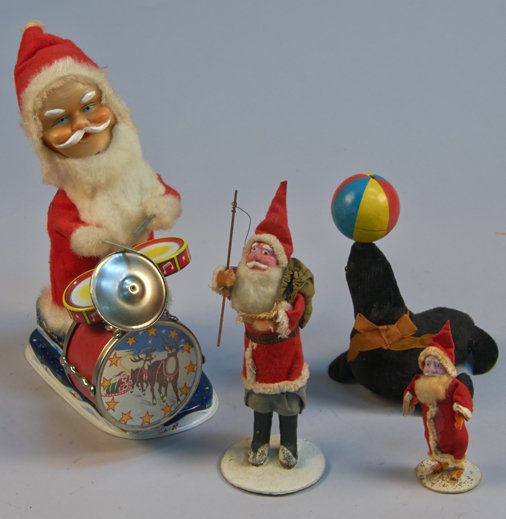Lot of 4 - Vintage Misc. Made in Japan Toys:: Lot of 4 - Vintage Misc. Made in Japan Toys: 1 - Santa Claus playing drums, litho. tin, fabric, rubber, battery op. - 10"h., 1 - Seal balancing ball on nose, litho. tin, felt, wind-up - 7"h., 1 - Sant