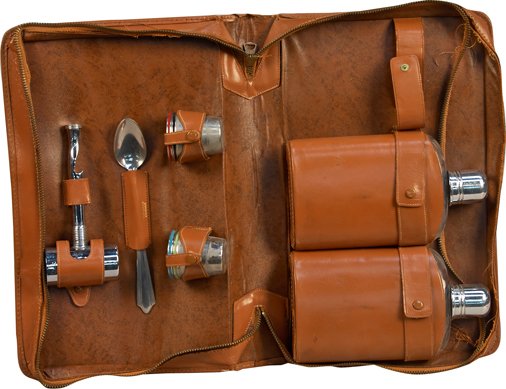 Lot of Portable Bar Items in Leather Carrying Case:: Lot of Portable Bar Items in Leather Carrying Case: Includes 2 - Glass flasks in leather holders labeled "Scotch" and "Rye" in gold lettering, 4 - Metal shot glasses, 1 - Spoon & 1 - 2 oz. jigger w/ b