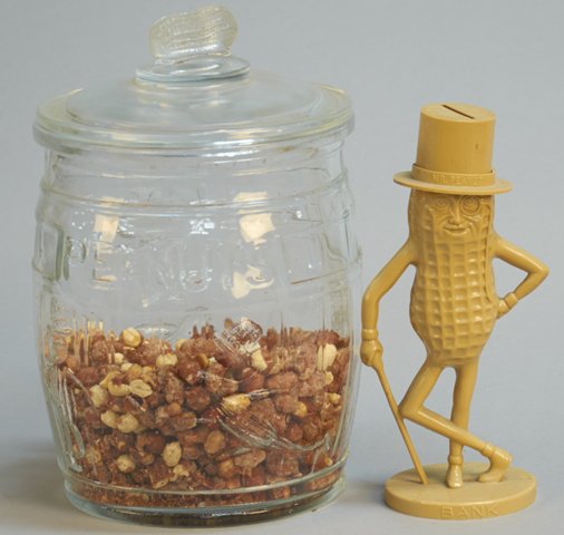 Lot of 2 Planters Peanuts Items:: Lot of 2 Planters Peanuts Items: 1 - Embossed glass "Planters Peanuts" jar w/lid, featuring Mr. Peanut Man & peanut-shaped handle & 1 - Figural plastic Mr. Peanut Man bank