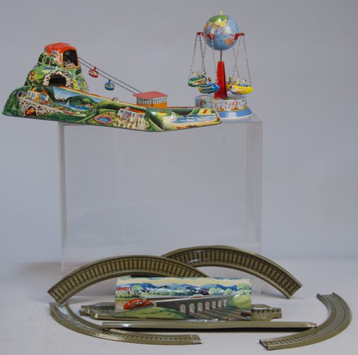 Lot of 3 - Vintage Made In Germany Litho. Tin: Lot of 3 - Vintage Made In Germany Litho. Tin Toys: 1 - Technofix "Cable Car" No. 303, c1950's (not complete) - 18" x 8"h., 1 - clock-work rotating globe merry-go-round style carnival ride c1950's - 8