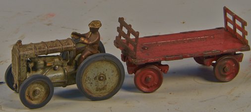 Lot of 2 - Vintage Arcade Cast-Iron Farm Items:: Lot of 2 - Vintage Arcade Cast-Iron Farm Items: 1 - Whitehead & Kales Tractor, gray w/ gold trim, black rubber tires, copper finished driver (no steering wheel) - 6"l. & 1 - Whitehead & Kales Wagon, r