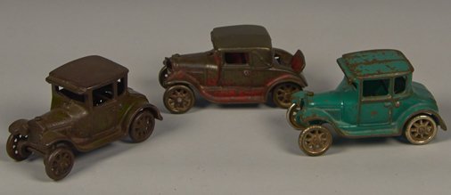 Lot of 3 - Vintage Arcade Cast-Iron Coupe Style Cars: Lot of 3 - Vintage Arcade Cast-Iron Coupe Style Cars c1928-1930's: 1 - Model A w/ rumble seat, red - 5"l. & 2 - Fords (green, brownish) - each 5"l