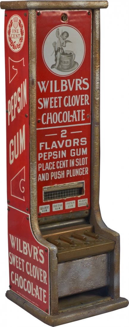 1 Cent Wilbur's Chocolate 4-Column Vending Machine c189: 1 Cent Wilbur's Chocolate 4-Column Vending Machine c1899, by Champion, porcelain front & sides, dispenses chocolate & 2 flavors of pepsin gum, and has the Wilbur's trademark of a cupid w/ a cup of coc