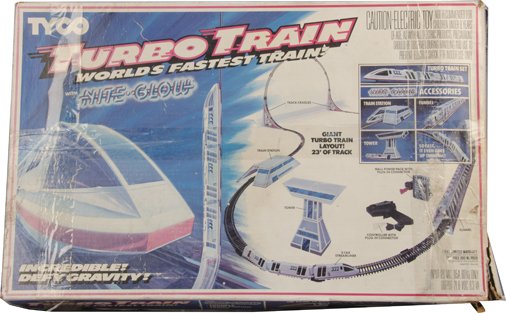 Tyco Turbo Electric Train Set In Original Box: Tyco Turbo Electric Train Set In Original Box, "World's Fastest Train! With Nite Glow", "So fast, it even goes up the wall!", Includes train station, tunnel, tower & 23' of track