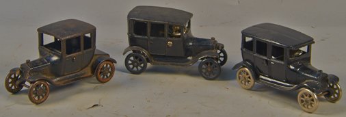 Lot Of 3 - Early Arcade Cast-Iron Cars c1920's:: Lot Of 3 - Early Arcade Cast-Iron Cars c1920's: 1 - Ford Model-T Sedan "Center Door" w/ removable driver, 1 - Ford Model-T Coupe & 1 - Chevrolet Superior Sedan w/ removable driver - each approx. 7"l