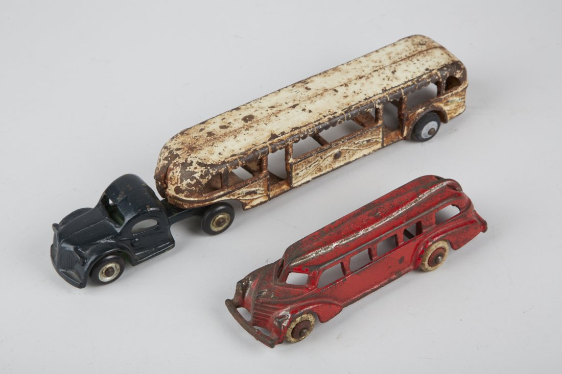 Lot of 2 - Cast-Iron Bus Style Toys:: Lot of 2 - Cast-Iron Bus Style Toys: 1 - Arcade - Century of Progress bus/truck No. 3220 c1933 - approx. 10-1/2"l. (lots of rust) & 1 - Hubley bus (futuristic), white rubber tires, c1938 - approx. 5-1