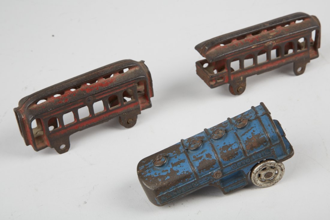Lot of 3 - Misc. Cast-Iron Toys:: Lot of 3 - Misc. Cast-Iron Toys: 1 - A.C. Williams gasoline/motor oil tank trailer (only) - 4"l. & 2 - red trolley/passenger train cars (missing wheels) - each 4"l