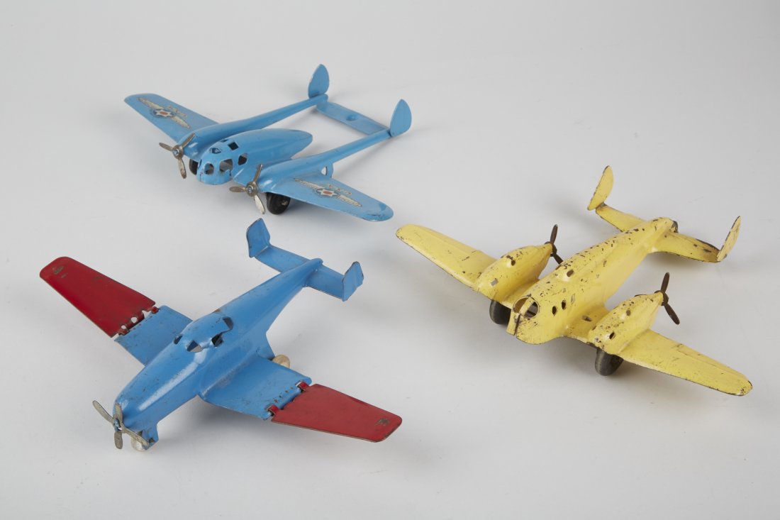 Lot of 3 - Wyandotte Pressed-Steel Toy Airplane: Lot of 3 - Wyandotte Pressed-Steel Toy Airplanes: 1 - blue, twin engine "Defense Bomber" - 8-1/2" wingspan, 1 - yellow, twin engine, props backwards - 8-1/2" wingspan & 1 - red & blue, single engine, 