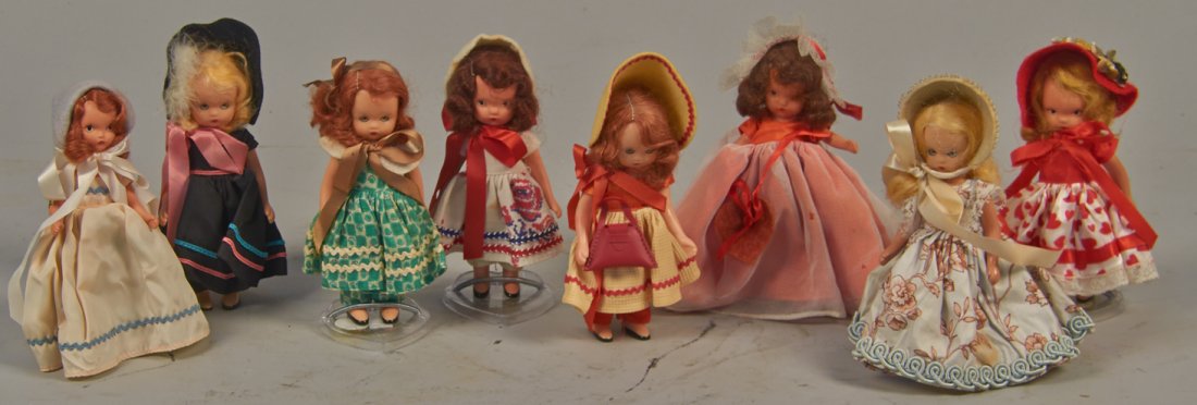 Lot of 8 - Nancy Ann Storybook Series Dolls:: Lot of 8 - Nancy Ann Storybook Series Dolls: 1 - No. 174, Flossie From Dublin, plastic, 2 - No. 157's, Queen of Hearts, bisque, 2 - No. 114's, Over The Hills, bisque, 1 - No. 111, School Days, plastic
