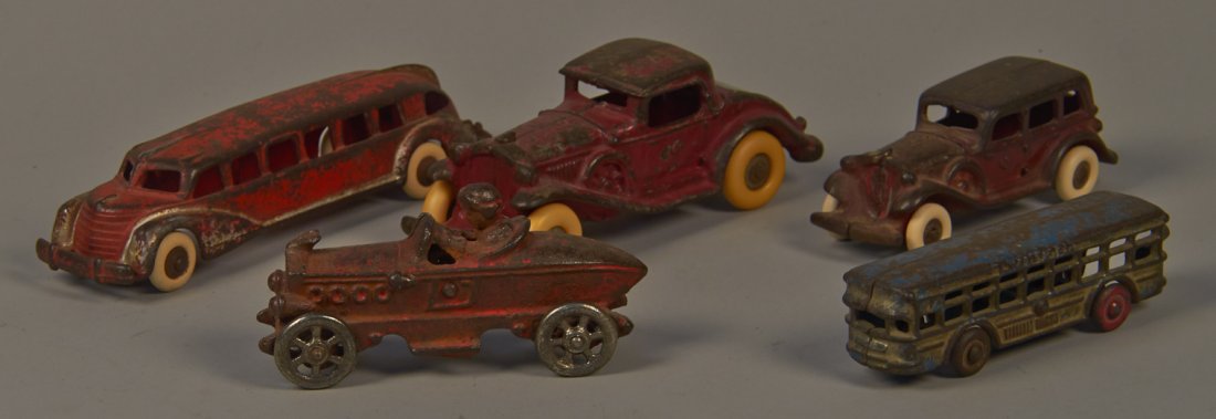 Lot of 5 Misc. Cast-Iron Toy Vehicles:: Lot of 5 Misc. Cast-Iron Toy Vehicles: 1 - AC Williams bus - 5", 1 - AC Williams red coupe side mount car c1930's - 6 3/4", 1 - Bullet-shaped race car w/ nickel wheels - 5", 1 - Packard sedan side mou