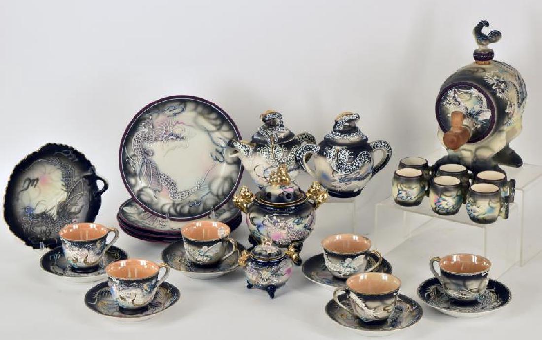 Large Collection Of Dragon Ware: Consisting Of One Sake Cast With Six Cups Has Both Cork Top And Spigot, No Cracks Or Chips On It, Cast Measures 8" With Top, Two Incense Jars, One Small One Measures 3" With Lid And Other Measures 6 W