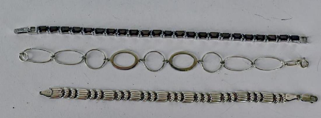 Three Sterling Silver Bracelets: Consists Of One With Smokey Quartz In Silver, Another Is Chain Linked And Another Link Design.