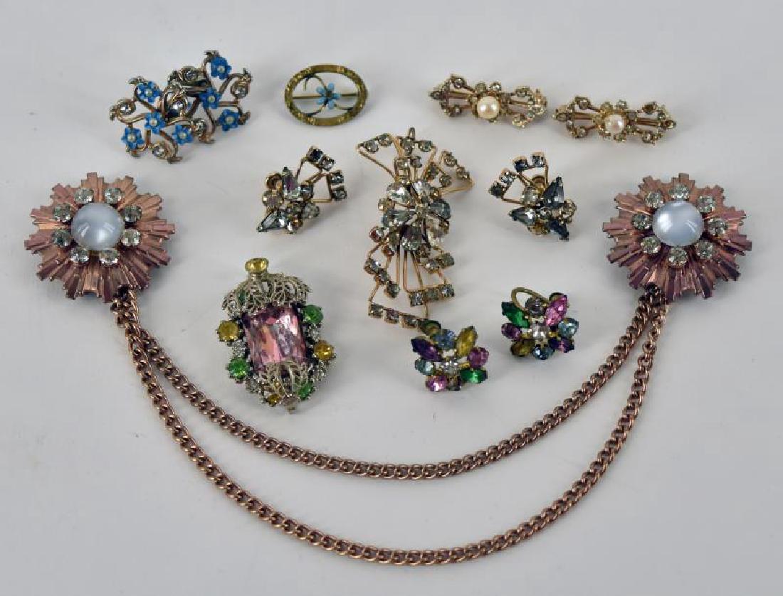 Collection Of Goldtone And Rhinestone Jewelry: Consisting Of A Gold Filled Demi-parure Rhinestone Pin And Earrings, A Rhinestone Sweater Clip, Camel Blue Flower And Rhinestone Earrings And More.