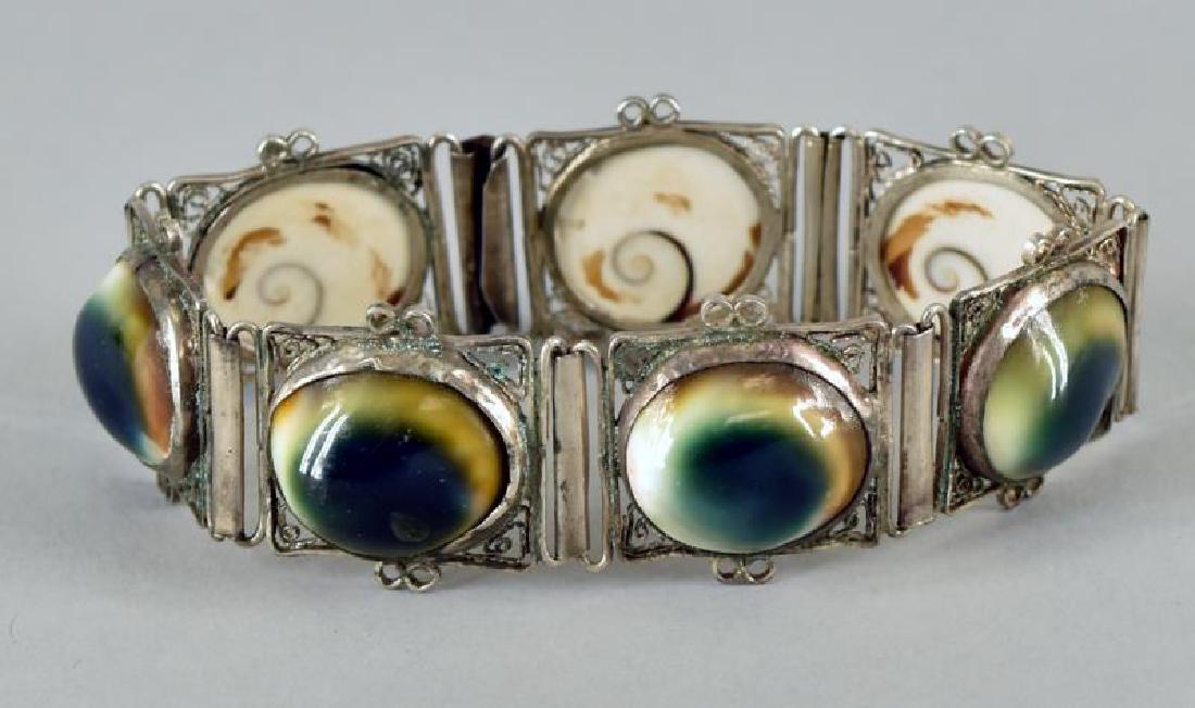 Vintage Operculum Cat's Eye Bracelet: Filigree Setting, Measuring 7" Long And .75" Wide. Unmarked, Possibly Sterling Filigree.