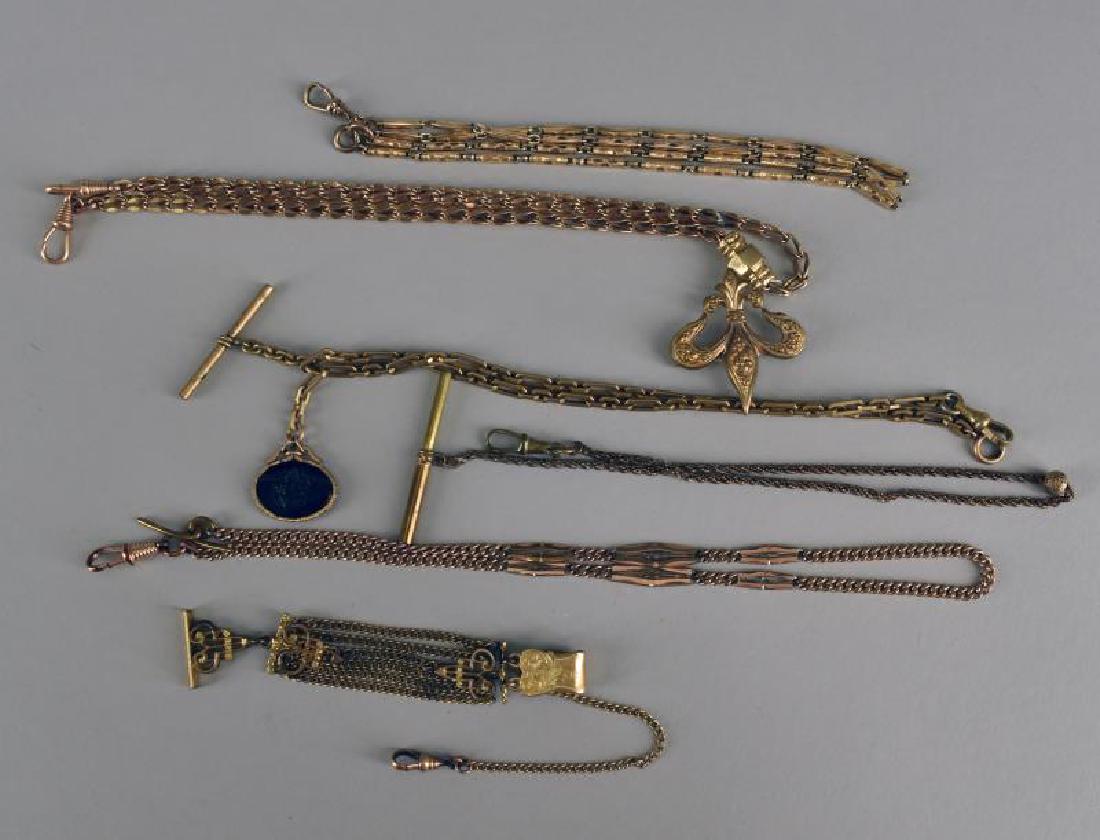 Group Of Gold Filled Watch Fobs: Consisting Of Six Chains And Fobs With Fleur-de-lis, Intaglio Roman Disc, And Decorative Chains