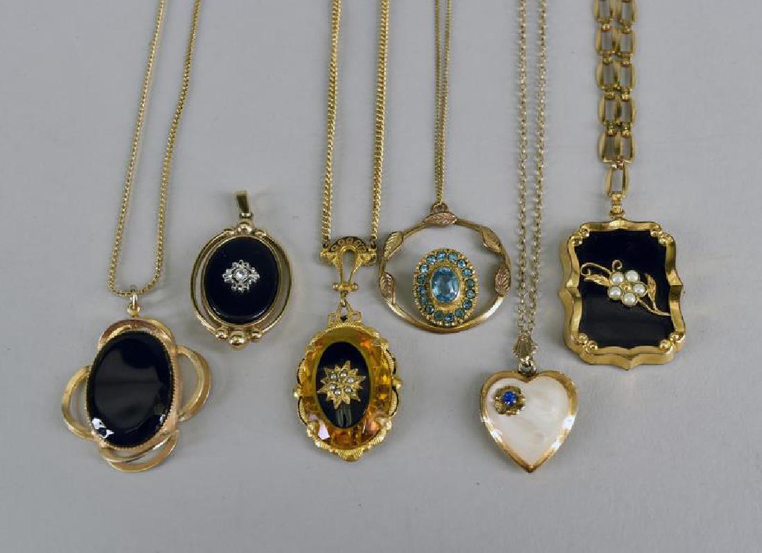 Group Of Victorian Necklaces: Consisting Of A Book Chain Faux Pearl Necklace, A Locket, Two Black Pendants, An Amber Glass Pendant And Blue Glass Pendant