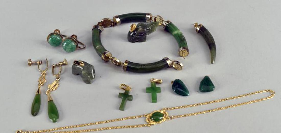 Group Of Jade Jewelry: Consisting Of Two Elephant Pendants, Pair Of Button Earrings, A Pair Of Drop Earrings, Two Cross Pendants, Two Stone Pendants A Tusk Shaped Pendant, A Bracelet And A Broken Bracelet With Four Jade Pie