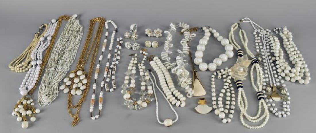 Group Of White And Goldtone Jewelry: Consisting Of Trifari Goldtone And White Necklaces, Acrylic Necklace, Mother Of Pearl Necklace, Several Glass Bead Necklaces And Five Pair Of Earrings