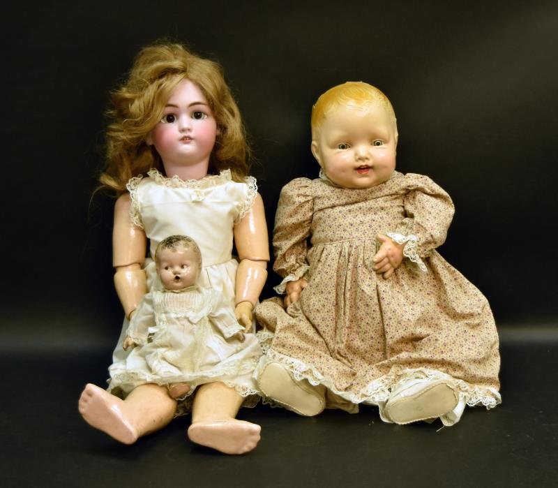 German Simon & Halbig Jutta No, 1349 Bisque Doll: Consisting Of A Ball Jointed Body, Open Mouth, Showing Teeth, Measuring 28 Tall, High Color. Together With A Composition Molded Hair Tin Eyed Doll, Measuring 23" Tall, Open Mouth Showing Teeth, Sleepy