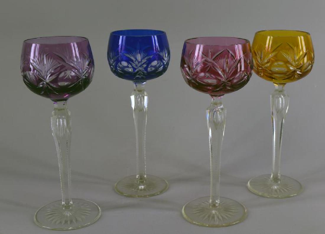 St. Louis Or Bohemian Cut To Clear Stemware: Consisting Of Four Matching Wine Glasses In Purple, Yellow, Blue And Cranberry. They Measure 8" Tall, There Is A Controlled Bubble In The Inside Of The Stem Of Each Goblet. All Are In Excellent Condit