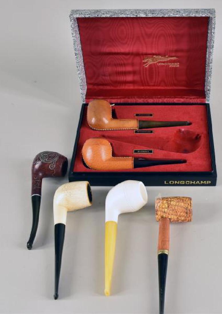 Group Of Six Pipes: Consisting Of A Box With Two Longchamp Leather Pipes, An Laid Pipe, A Corn Cob Pipe And Two Resin Pipes.