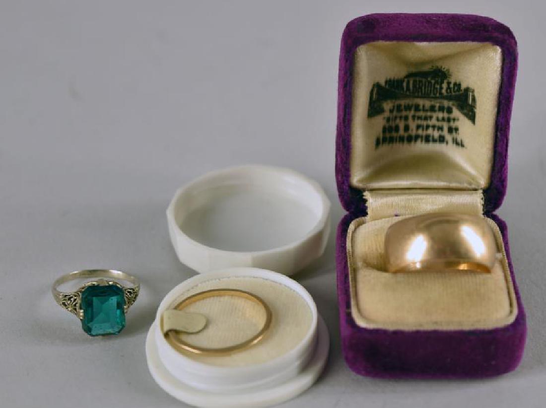 Three 14k Gold Rings: Consisting Of Two Gold Wedding Bands, Size 7 And A White Gold Filigree Ring With A Green Stone, Size 5, 10.2g. Along With Two Vintage Ring Boxes.