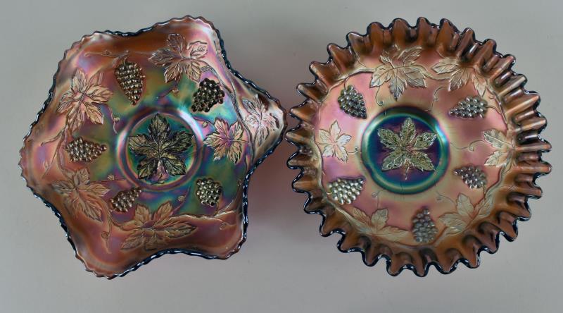Fenton Grape Amethyst Carnival Glass Bowls: Consisting Of Two Fenton Grape Bowls Both In Amethyst Carnival Glass. One Has A Candy Ribbon Edge, The Other A Ruffled Stippled Edge. Both Are In Good Condition, No Nicks, Chips Or Cracks. The Candy R