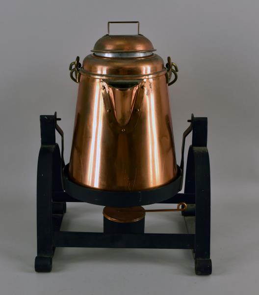 Chuck Wagon Coffee Pot On Cast Iron Trivet: Large Copper Coffee Pot With Warmer On Wrought Iron Trivet. Trivet Tilts For Pouring. The Coffee Has The Wood Bail Handle And Bunsen Burner Heater. The Coffee Pot And Trivet Measures 16" Tall, 11.5" W