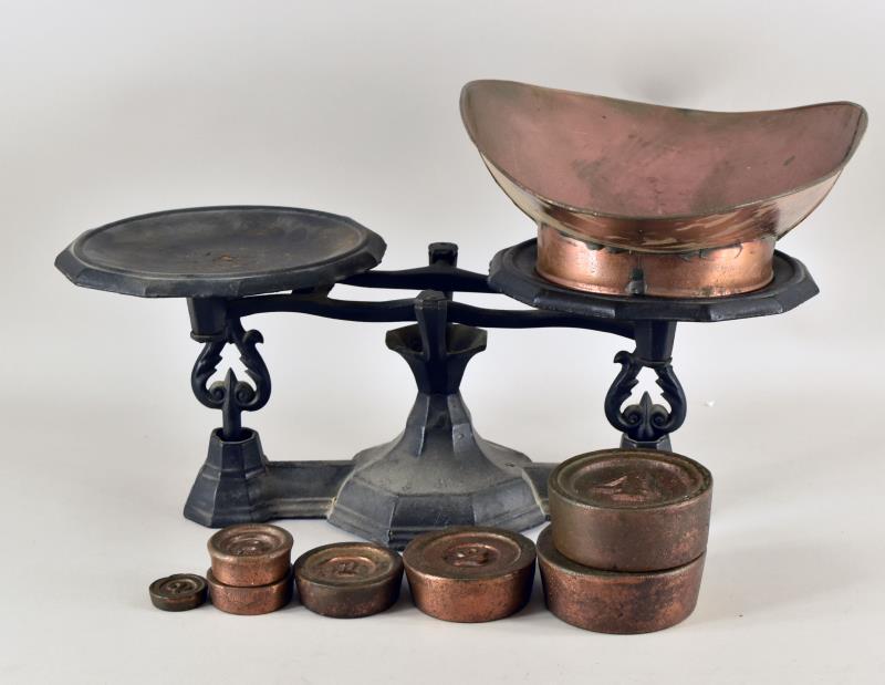 Cast Iron Grocery Scale: Consisting Of A Balanced Scale With A Copper Bowl And Seven Iron Weights. The Weights Are 2-4 Pound Weights, 1-2 Pound Weight, 1-1pound Weight, 2-8 Oz Weights And A 2 Oz Weight. The Scale Measures 19.