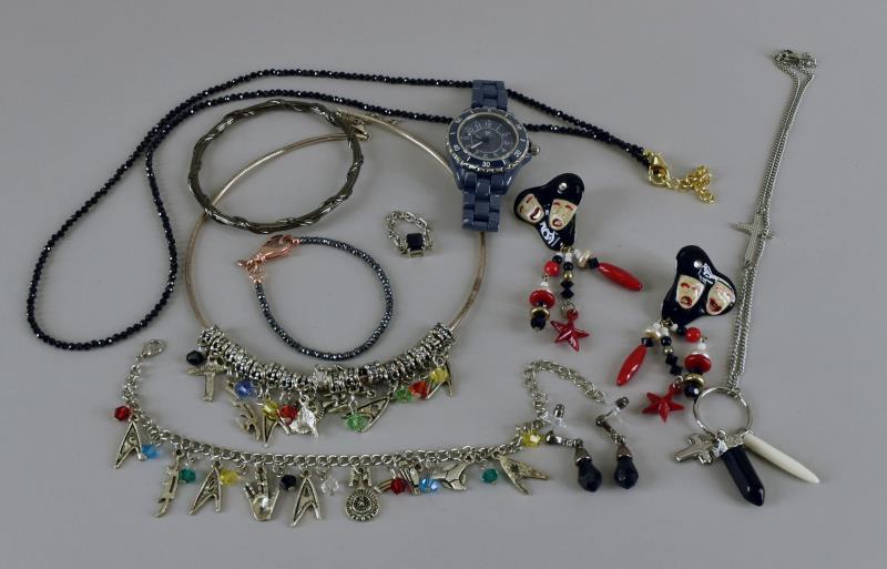 Group Of Sterling & Costume Jewelry: Consisting Of A Sterling Omega Necklace With Charms, The Necklace Is Marked 925, The Charms Are Not. Together With A Faceted Black Glass Bead Necklace, A Charm Bracelet, Comedy/tragedy Earrings, Facet