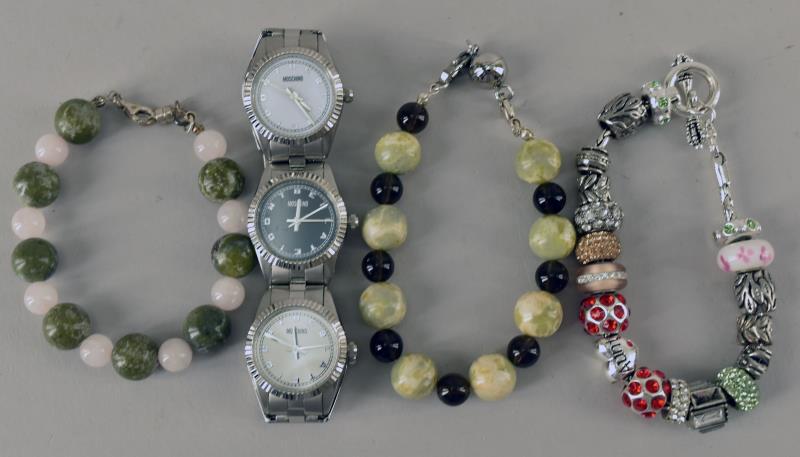 Group Of Bracelets And Watch: Consisting Of A Moschino Multi Face Wrist Watch And Three Bracelets.