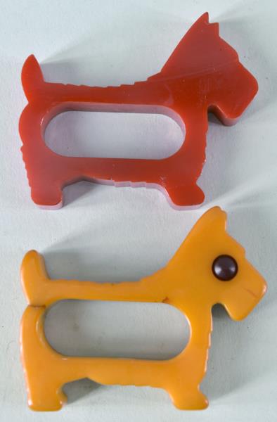 Bakelite Scotty Dog Napkin Rings: Featuring A Butterscotch And Red Bakelite Scotty Dog Napkin Rings. The Butter Scotch Dog Has The Bakelite Eyes And Measures 2.75" Long And 2.25" Wide, It Has A Crack In The Tail. The Red Napkin Ring H