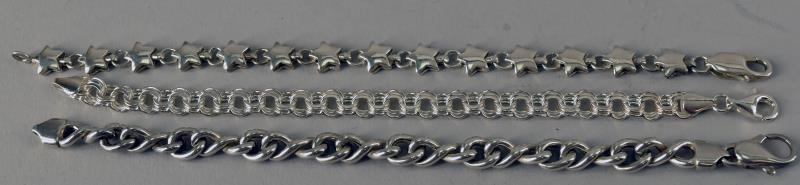 Sterling Silver Chain Link Bracelets: Featuring Three Sterling Bracelets, All Marked 925. The Star Link Bracelet Measures 7.5" Long The Other Two Are 7" Long. All In Good Condition.