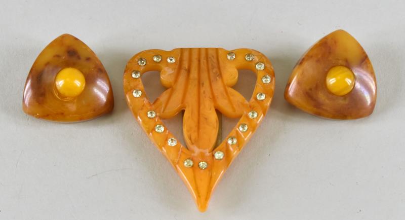 Butterscotch Bakelite Earrings And Dress Clip: Featuring An Art Deco Design Dress Clip With Rhinestones And Triangle Shaped Clip Earrings. The Dress Clip Measures 2" Long And 2" Wide. All The Pieces Have Been Tested And Guaranteed To Be Bakelite. 