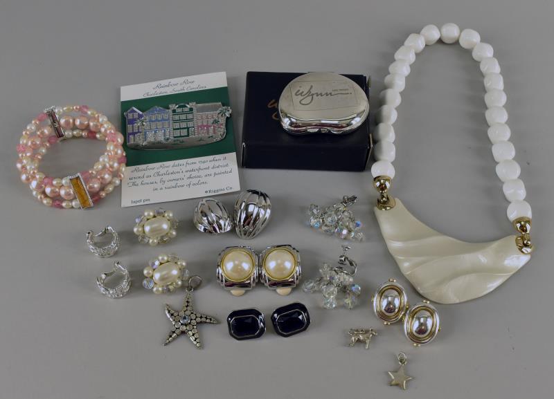 Group Of Contemporary Costume Jewelry: Featuring Seven Pairs Of Earrings, Three Sterling Pendants Or Charms, A Faux Pearl Bracelet , A Charleston Rainbow Row Pin, A Mirror Souvenir From The Wynn In Las Vegas And A Trifari White Necklace.