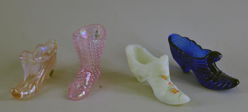 Four Fenton Glass Shoes And Boots: Consisting Of A Signed Fenton Burmese Glass Shoe, Signed By Trudy Mendenhall. Together With Two Pint Iridescent Glass Boots And A Cobalt Blue Shoe. All With The Fenton Foil Label, All In Excellent Con