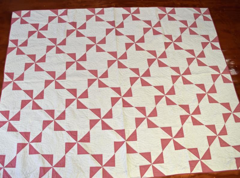 Pink And White Whirligig Quilt: Featuring A Hand Quilted And Hand Pieced Pink And White Quilt In The Whirligig Pattern, Machine Hemmed. The Quilt Measures 81" X 64", 14 Spi, Good Condition, No Rips Or Tears, May Need Washed.