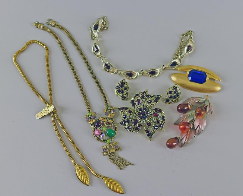 Group Of Costume Jewelry: Consisting Of Three Vintage Necklaces, A Red Rhinestone Pin And Earrings, A Grape Cluster Pin And A Free Form Modern Pin. No Hallmarks.
