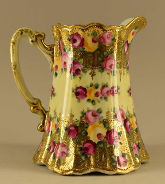 Nippon Tokio Wheelock Gold Encrusted Pitcher: Featuring A Hand Painted Yellow, Red And Pink Roses Pitcher. Signed Tokio Wheelock, Japan. The Pitcher Measures 7" Tall And 6.5" Spout To Handle. The Pitcher Is In Very Good Condition, There Are No Ni